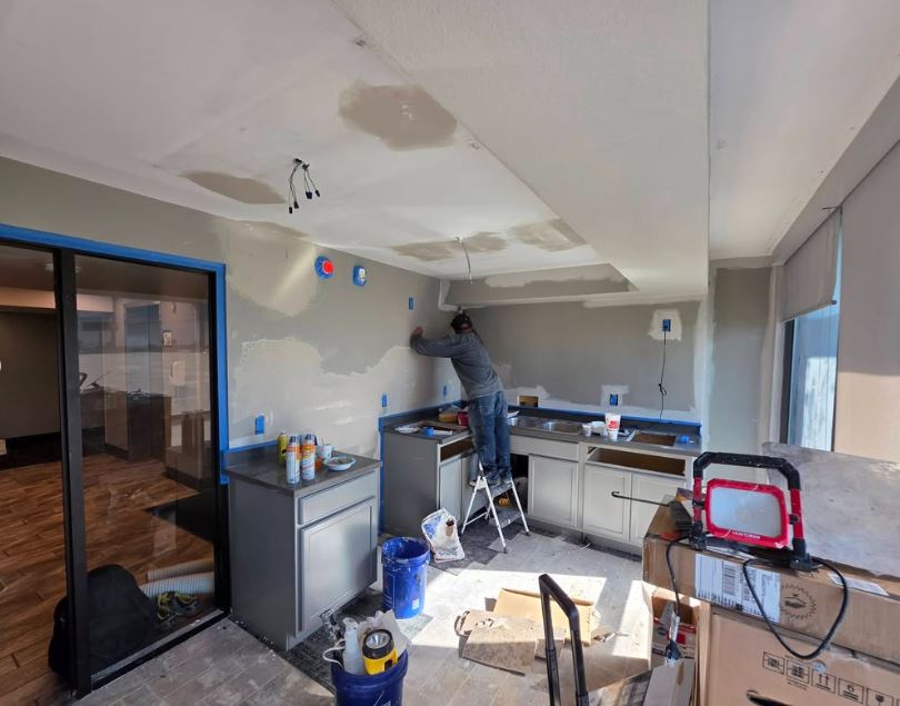 Renovation in progress — new drywall going up